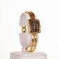 AW dámske hodinky vo farbe zlata s čiernym ciferníkom s rímskymi číslicami - KlenotTV.sk